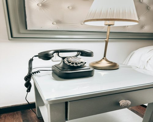 Putting away the phone on a nightstand